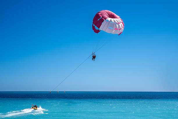 istock Parasailing over the blue sea 2236418459