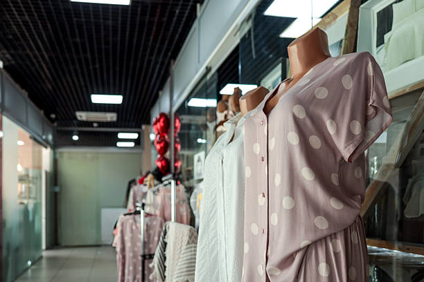 Elegant and luxury dresses in detail in a boutique store.