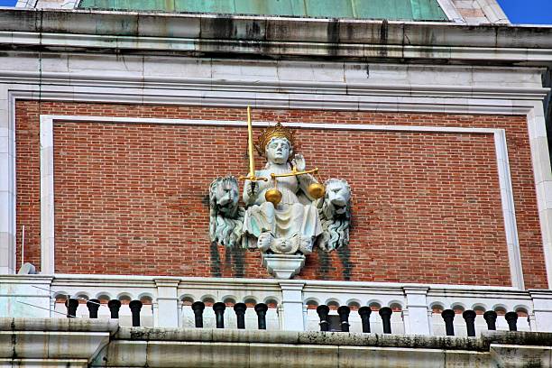 Detailed view of the sculpted baroque facade of San Moisè Church in Venice, Italy, featuring ornate stone decorations, statues, reliefs, and architectural elements typical of Venetian religious architecture. The image documents historic craftsmanship and monumental design in the urban context of Venice.