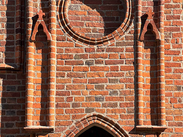 istock Brick facade with gothic circular and arched details 2236432193