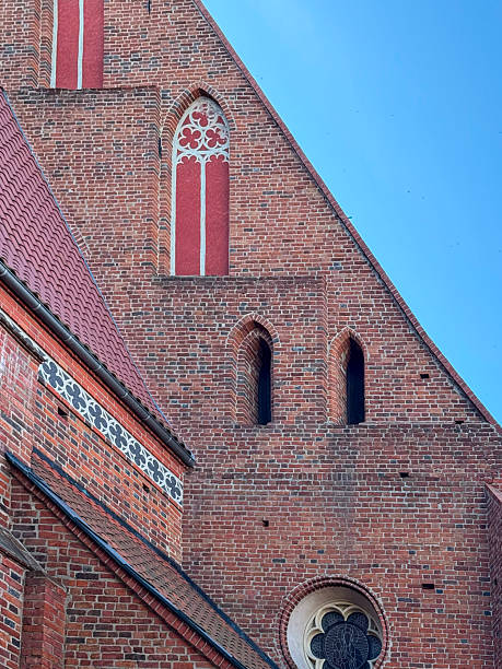 istock Medieval gothic church facade with red painted details 2236433144