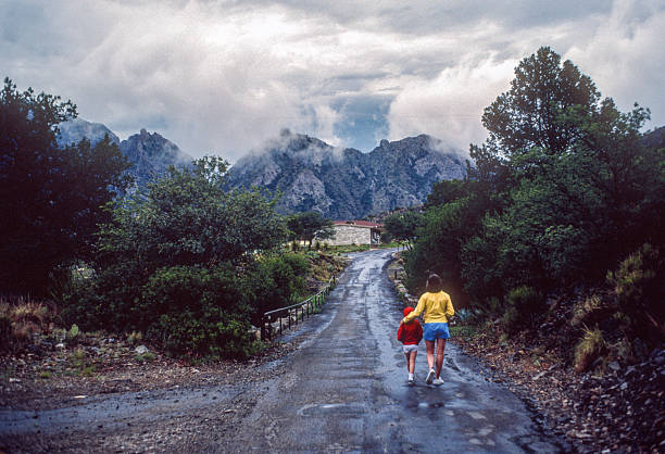 istock Big Bend NP - Mother & Daughter Walk on Chisos Basin Road - 1984 2236433431