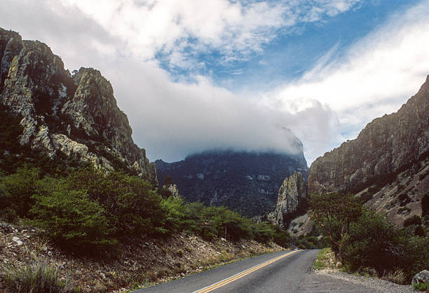 istock Big Bend NP - Chisos Basin Road & Clouds - 1984 2236433494