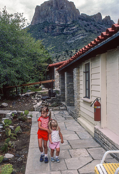 istock Big Bend NP - Sisters Outside Chisos Basin Cabin - 1984 2236433534