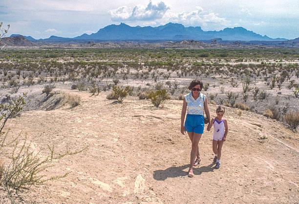 istock Big Bend NP - Mother & Daughter with Distant Mountains - 1984 2236433557