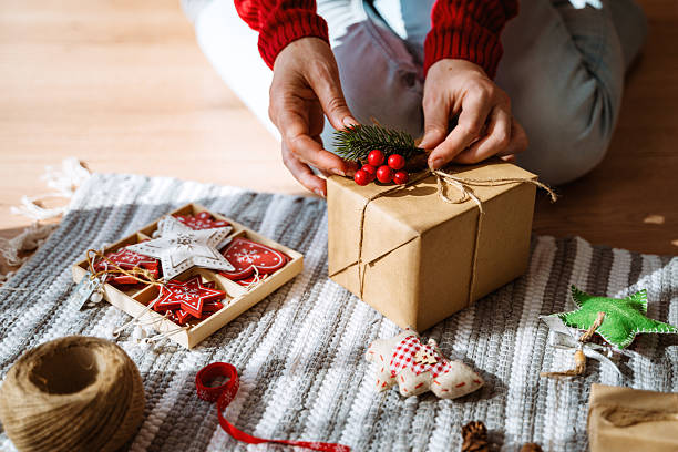 istock Holiday Gift Wrapping with Christmas Cookies and Rustic Details 2236434525