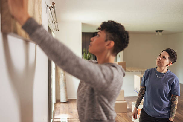 istock Lesbian Couple Decorating New Home Together 2236437181