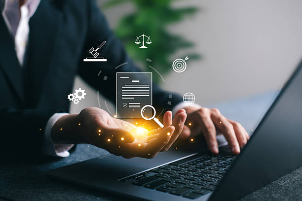 istock Businessman analyzing digital legal document and compliance icons using a laptop. Concept for law, regulations, policy, and corporate governance in digital transformation. 2236437245