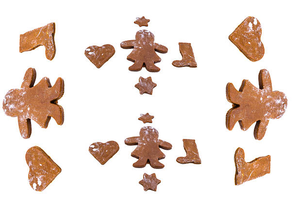 A close up of a ginger bread man with a bite missing out of his head. Isolated on white.