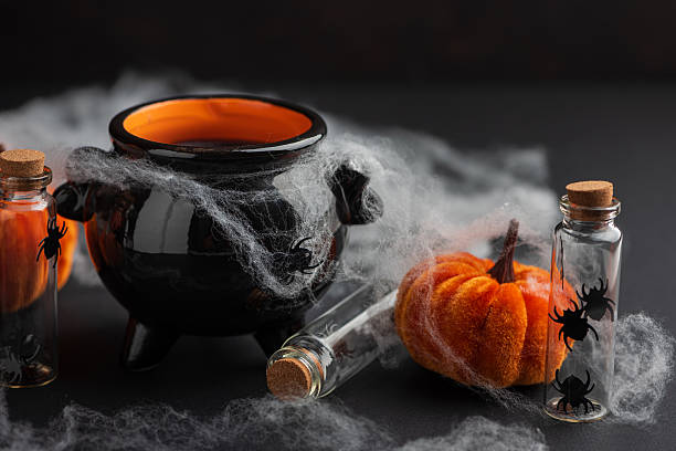 istock Halloween Cauldron with Pumpkins, Spiders and Cobwebs 2236444485