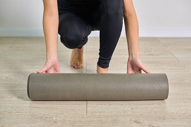 istock Woman preparing foam roller on wooden floor for exercise 2236446952