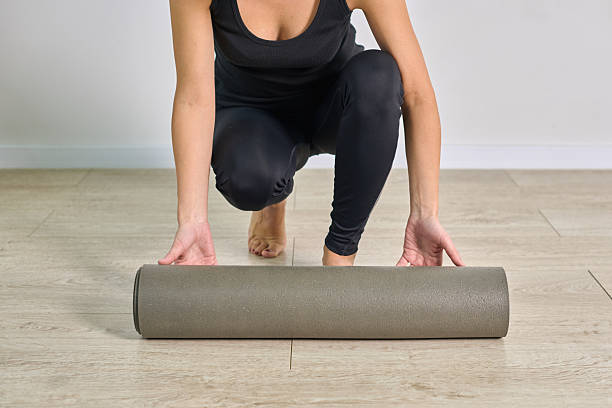 istock Woman preparing foam roller on wooden floor for exercise 2236446968