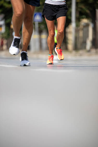 istock Running legs in city marathon race 2236448469