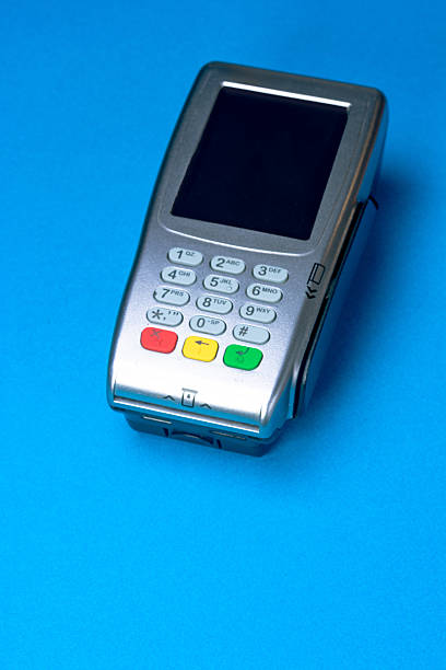 istock Pos terminal on blue background representing cashless payment systems 2236450033