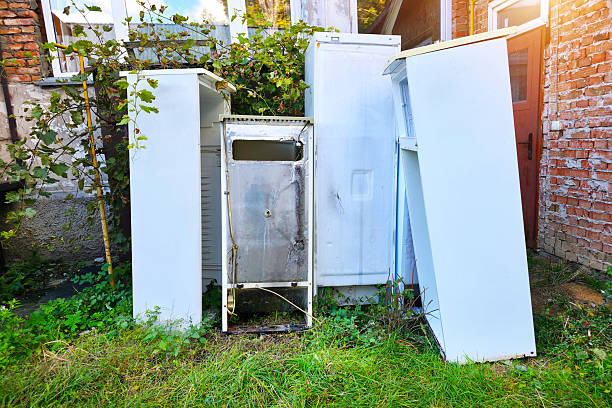 istock Old refrigerators under a building. A dump of abandoned household appliances. 2236452585