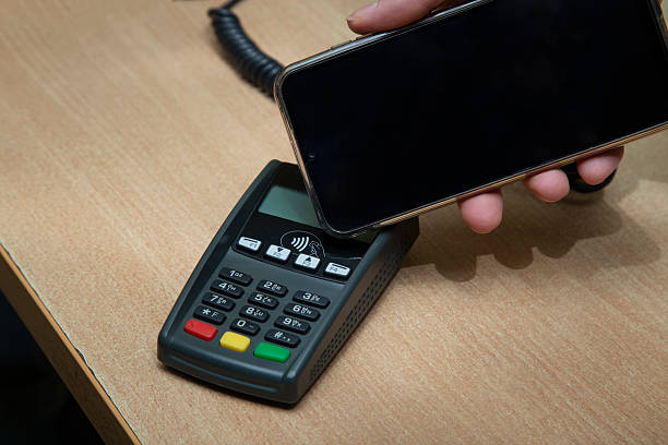 istock Contactless payment using a smartphone instead of a payment card. 2236454202