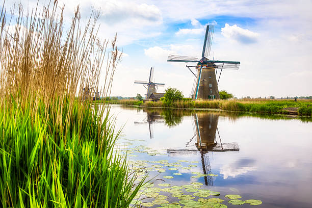istock Canal and Old, Charming Windmills in Kinderdijk, Netherlands 2236460074