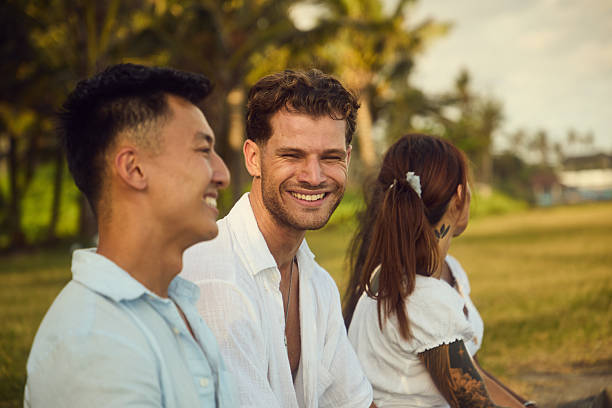 istock Friends sharing laughter outdoors on a sunny day in a casual setting 2236464080