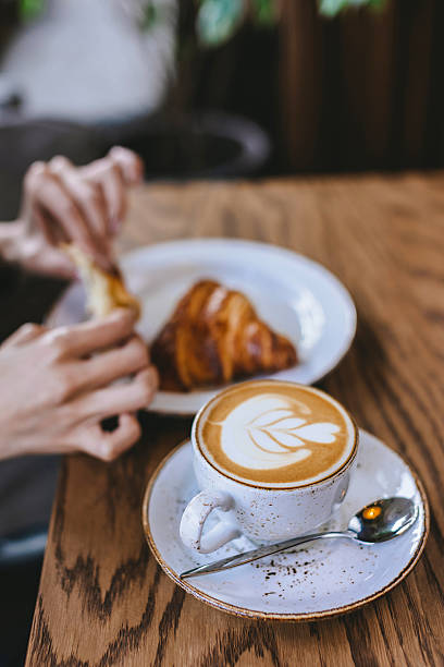 istock Coffee art at latte cup on wooden table at modern restaurant during lunch time 2236464344