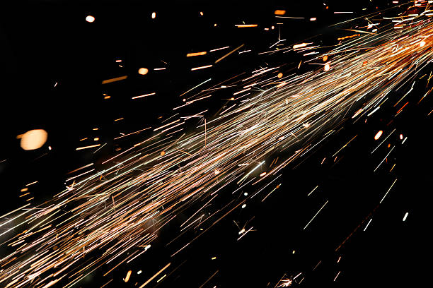 bright sparks of metal against dark background