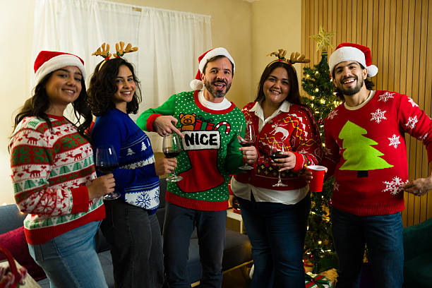 istock Relaxed young adults celebrating christmas wearing funny ugly sweaters 2236466450