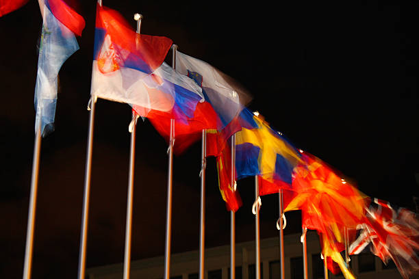 Flags fluttering in the wind on the Promenade des Anglais in Nice, France.