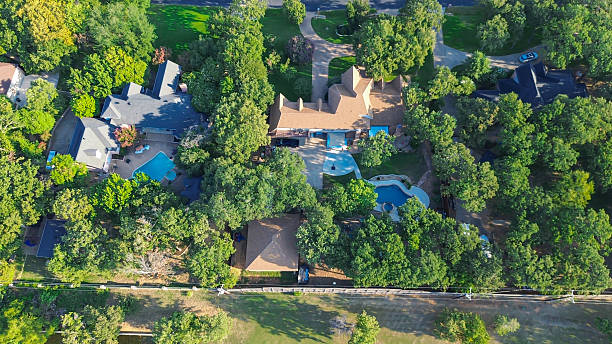 istock Spacious backyard of luxury homes in Lantana, Texas, swimming pools, and dense tree coverage. Highlights outdoor recreation, privacy, and affluent suburban lifestyle in suburbs Dallas Fort Worth 2236473277