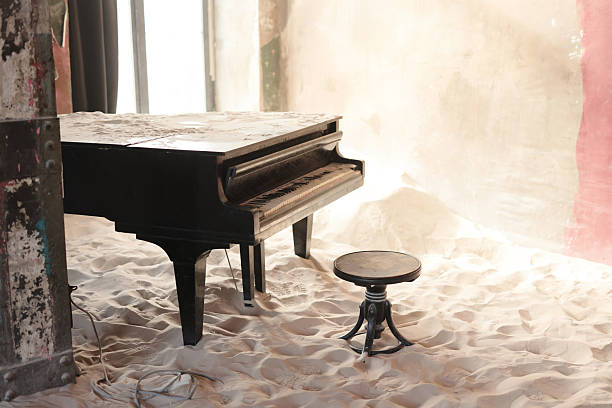 Abandoned Piano Sitting Solitarily in a Sandy Environment, Evoking Deep Emotions and Nostalgia