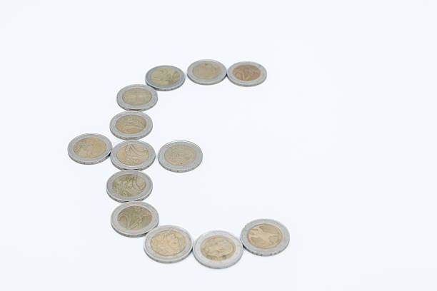 istock Euro coins forming currency symbol on white background 2236478509