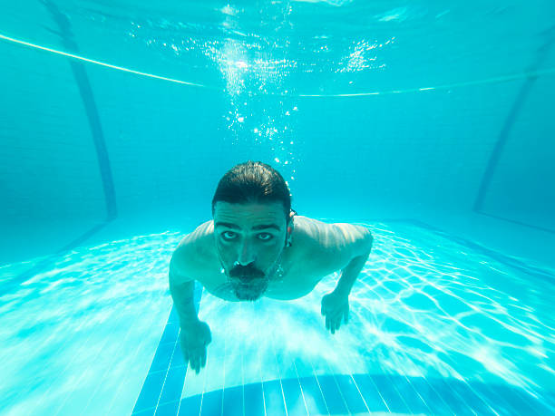 Young man enjoying the pool during the summer holidays