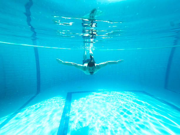istock Young man enjoying the pool during the summer holidays 2236484165