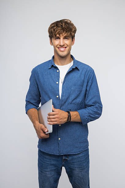 istock Portrait of confident young man 2236486164