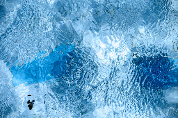 istock Close-up of swimming pool water with sunlight reflections 2236487885