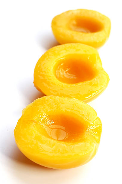 Peach halves in syrup. Fruity desserts