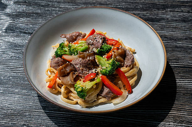 istock Top view of pasta with beef and broccoli. 2236489293