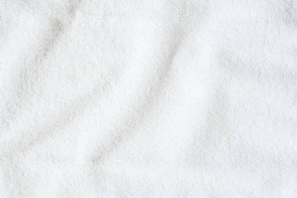istock White towel texture background or beach bath fabric, kitchen wiper towel or plain blank cloth bathroom rug made of soft clean cotton fiber material for linen laundry backdrop 2236489593
