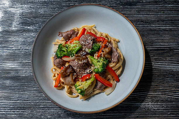 istock Top view of pasta with beef and broccoli. 2236489694