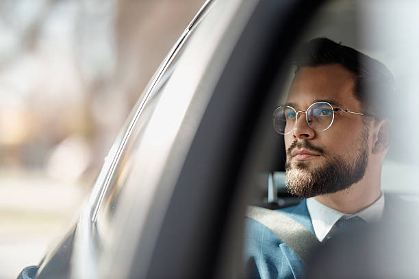 istock Businessman Talking on Phone Inside Car 2236489703