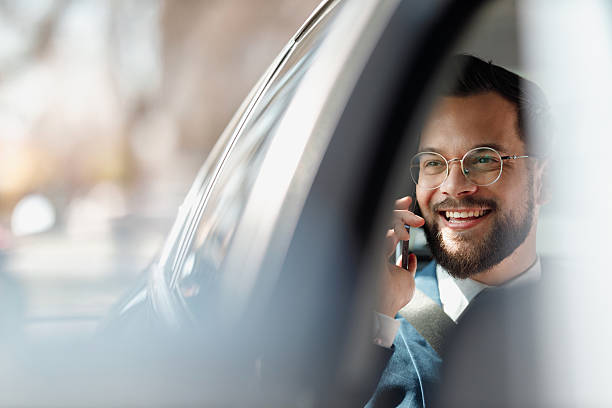 istock Businessman Talking on Phone Inside Car 2236489710