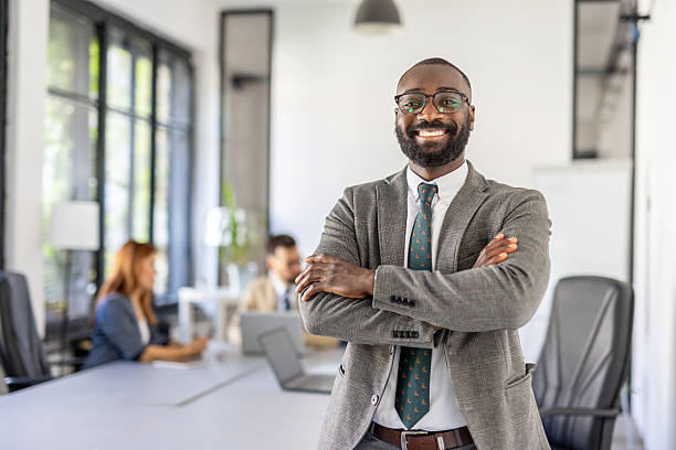 istock Confident businessman standing still with a broad smile. 2236490914