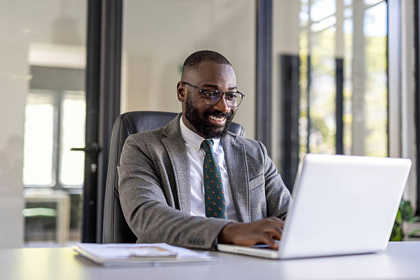 istock Professional man working on a laptop in a modern office. 2236490967