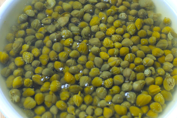 istock Capers in brine, small pickled flower buds 2236492336