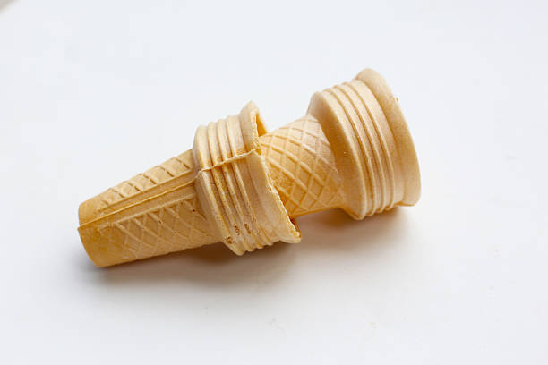 istock Two empty wafer ice cream cones on a white background. 2236493788