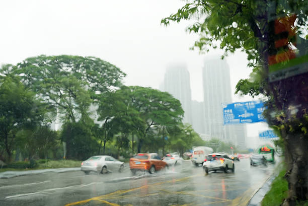 istock Busy traffic on road during storm rain through Car windshield 2236496069
