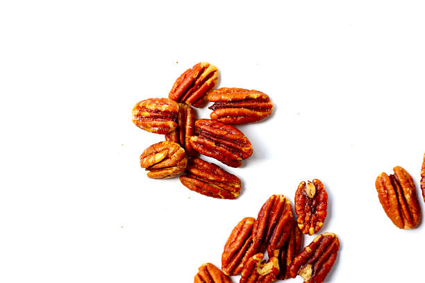 istock Delicious salted pecan nuts scattered. 2236496593