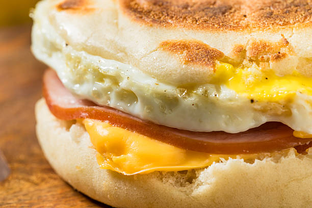 Homemade English Egg Muffin Sandwich with Cheese and Bacon