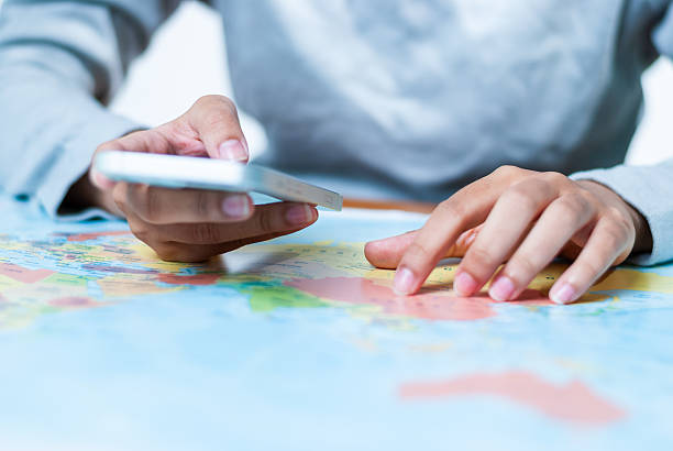 istock Exploring travel routes with mobile maps home office digital navigation indoor close-up perspective 2236506823