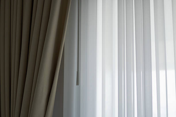 istock Natural light streaming through sheer curtains in modern room interior design minimalist style tranquil atmosphere 2236507300