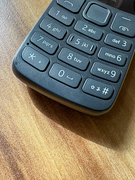 istock A black cell phone with a keypad on the side 2236514476