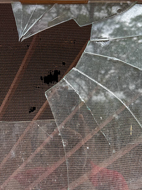 istock A window with a broken pane of glass 2236515715